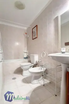 a white bathroom with a toilet and a sink at Apartment Wohnung in Funchal- in der Nähe von Farmers Market by Interhome in Funchal