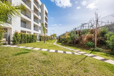 a walkway in front of a building at Oceanfront Bliss - Atlantico residences in Câmara de Lobos