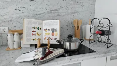 a kitchen counter with a stove with a pot on it at Downtown Funchal Bohemian Charm in Funchal