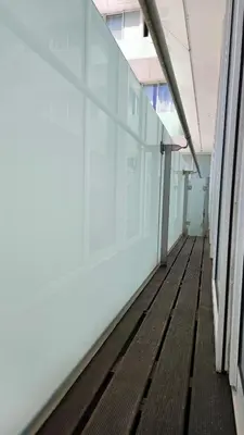 an empty hallway in an office building with glass walls at Downtown Funchal Bohemian Charm in Funchal