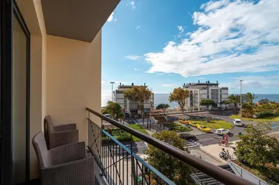 a balcony with a view of a street and buildings at Madeira Holidays Studio by Amazing Madeira in Funchal