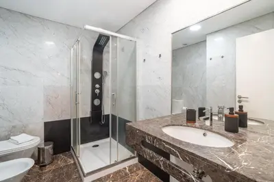 a bathroom with a sink and a shower at Madeira Holidays Studio by Amazing Madeira in Funchal