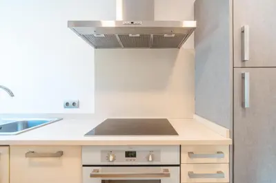 a kitchen with a stove and a sink at Madeira Holidays Studio by Amazing Madeira in Funchal