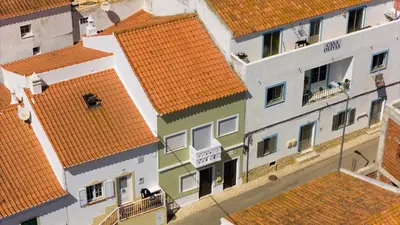 an overhead view of buildings with orange roofs at Casinha Menta in Carrapateira