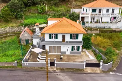 an aerial view of a house with an orange roof at Villa Jardim by GALMI in São Vicente