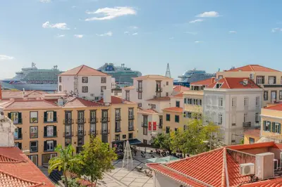 a view of a city with buildings and roofs at Angie's House in Funchal