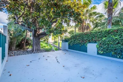 a large driveway with a fence and trees at Quintinha de São Martinho - Villa & Lux in Funchal