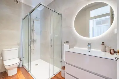a bathroom with a shower and a toilet and a sink at Quintinha de São Martinho - Villa & Lux in Funchal