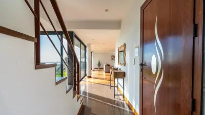 a hallway with a door leading to a living room at Villa Jamboeiro by LovelyStay in Funchal