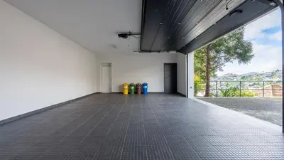 an empty room with a hallway with a window at Villa Jamboeiro by LovelyStay in Funchal