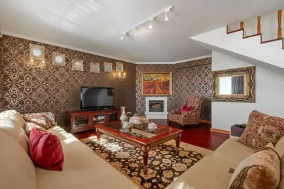 a living room with a couch and a tv at Cliff View Apartment - By Wehost in Funchal