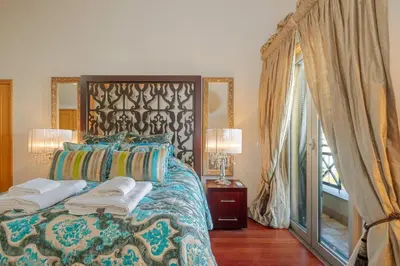 a bedroom with a bed with two towels on it at Cliff View Apartment - By Wehost in Funchal