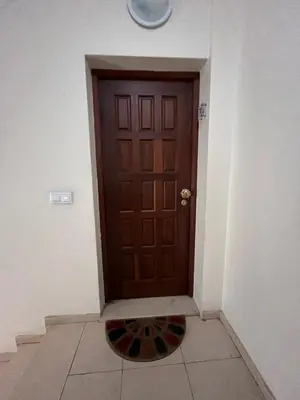a staircase in an office building with a stair case at Casa Do Arco - Machico Centre with Private Balconies and Parking in Machico