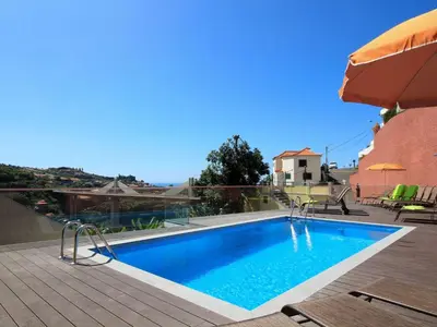 a swimming pool on the roof of a house at Holiday Home Villa Lapa in Câmara de Lobos by Interhome in Câmara de Lobos