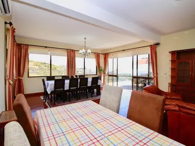 a dining room with a table and chairs and a dining room at Holiday Home Villa Lapa in Câmara de Lobos by Interhome in Câmara de Lobos