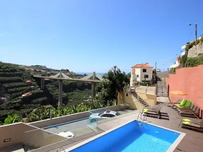 a swimming pool on the roof of a house at Holiday Home Villa Lapa in Câmara de Lobos by Interhome in Câmara de Lobos