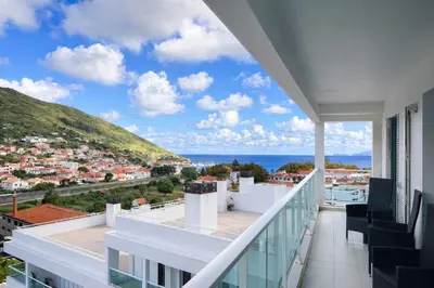 a balcony with a view of the ocean at Penthouse Montanha-Mar in Machico