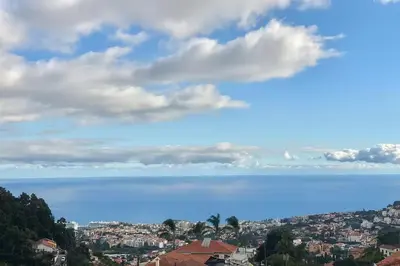 a view of the ocean and a city at Cozy Studio & Patio in Funchal in Funchal