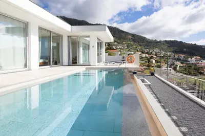 a swimming pool in a villa with a view at Bela Vista - pool in Arco da Calheta