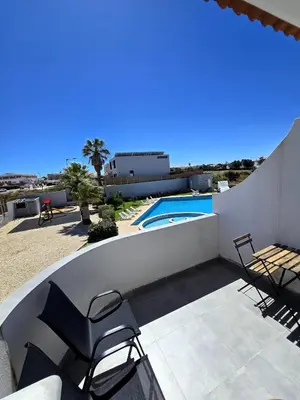 a patio with chairs and a swimming pool at Sagres Escape Near Mareta Beach in Sagres