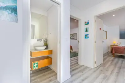 a bathroom with a sink and a mirror at NEW Salema Seaview in Salema