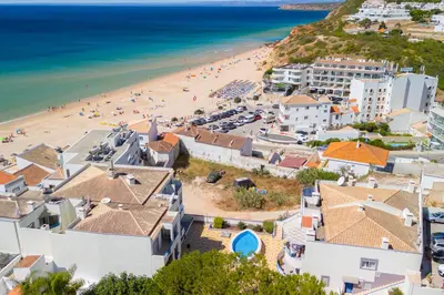 an aerial view of a beach and buildings at NEW Salema Seaview in Salema