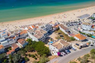 an aerial view of a beach and buildings at NEW Salema Seaview in Salema
