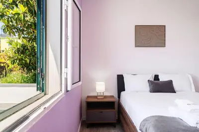 a bedroom with a bed and a window at GuestReady - Escape with Ocean and Mountain Views in Calheta