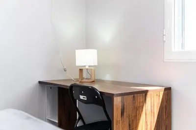 a bedroom with a desk with a lamp and a chair at GuestReady - Escape with Ocean and Mountain Views in Calheta