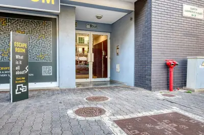 a red fire hydrant in front of a building at Emma's Place, a Home in Madeira in Funchal