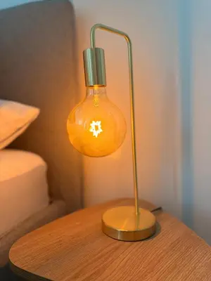 a lamp on top of a wooden table at Dona Mécia in Funchal