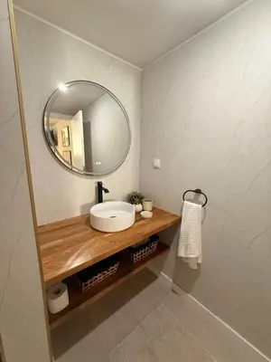 a bathroom with a sink and a mirror at Dona Mécia in Funchal