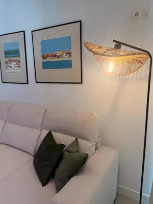 a living room with a couch and a lamp at Dona Mécia in Funchal