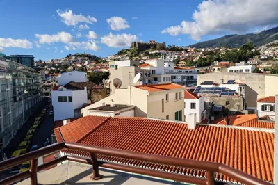 a view of a city with red roofs at Dona Mécia in Funchal