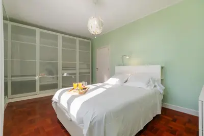 two beds in a room with a mural of flowers at Casa da Camélia in Funchal