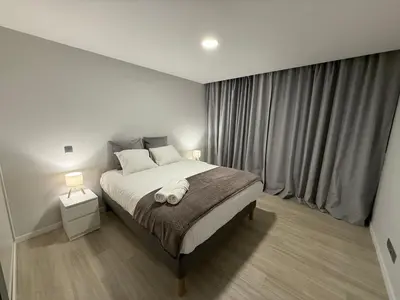 a bedroom with a bed with a towel on it at Penteada Golden Residence in Funchal