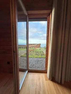 a room with a large window with a view at Sunset Eco Shelter 4 in Ponta do Pargo