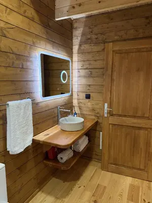 a bathroom with a sink and a mirror at Sunset Eco Shelter 4 in Ponta do Pargo