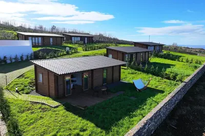 a tiny house on a hill with a yard at Sunset Eco Shelter 5 in Ponta do Pargo