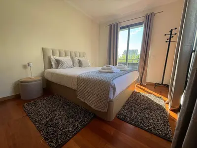 a living room with a dining room table and chairs at Madeira Sun Loft in Funchal in Funchal