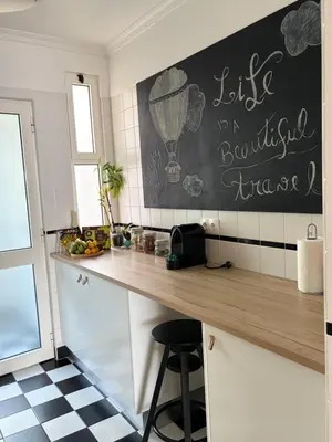 a kitchen with a counter and a chalkboard on the wall at Lido Sea Apart in Funchal