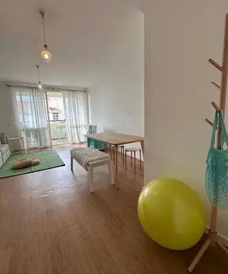 a living room with a table and a green ball at Lido Sea Apart in Funchal