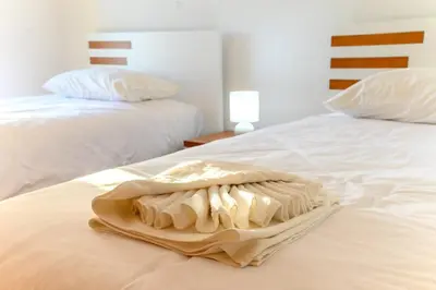 a towel is sitting on top of a bed at Assomada Sea Pearl by Mth in Caniço
