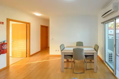 a dining room with a table and chairs at Assomada Sea Pearl by Mth in Caniço