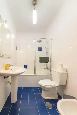 a bathroom with a toilet and a sink and a shower at Assomada Sea Pearl by Mth in Caniço