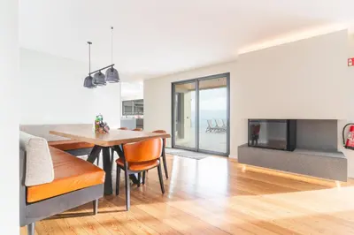 a dining room with a table and a fireplace at Eco Monte by Atlantic Holiday in Funchal