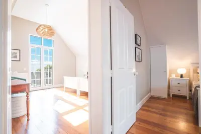 a hallway with a door leading to a living room at Casa dos Francelhos by Atlantic Holiday in Funchal