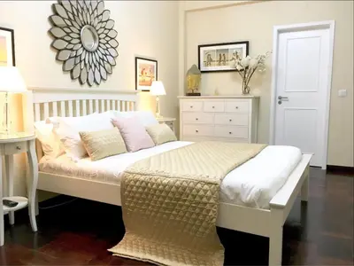 two beds in a small room with a mirror at City Centre - Savoy District Funchal in Funchal