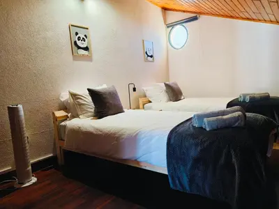 a hotel room with two beds in a room at Da Flat in Calheta