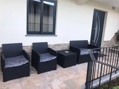 two chairs and a table on a balcony at Vivenda Silva in Seixal